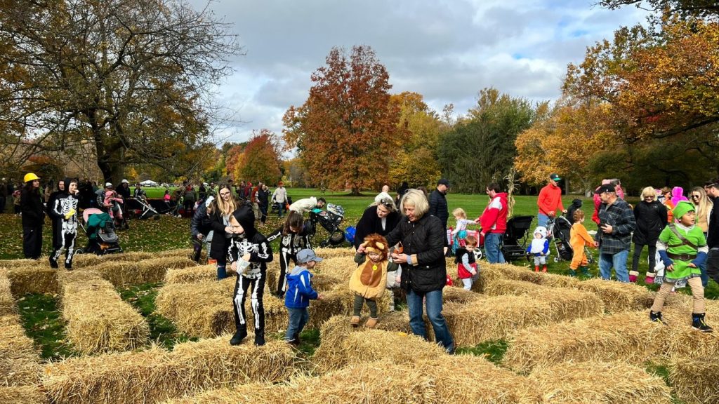 Kids play in the straw maze at Little Goblins