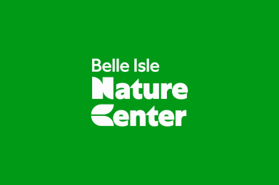 Logo for Belle Isle Nature Center with white text on a vibrant green background, highlighting the words “Nature Center” in bold.