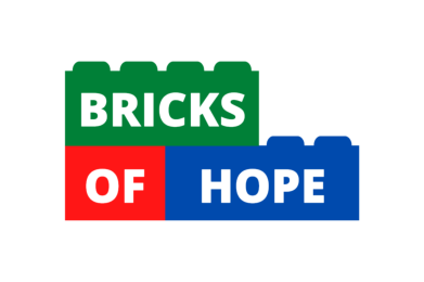 Bricks of Hope logo designed with colorful stacked toy bricks in green, red, and blue, spelling out the organization’s name.